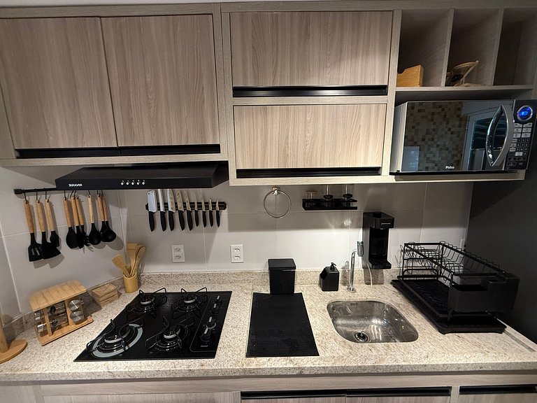 Flat Térreo Frente à Piscina com varanda gourmet - Flat 103